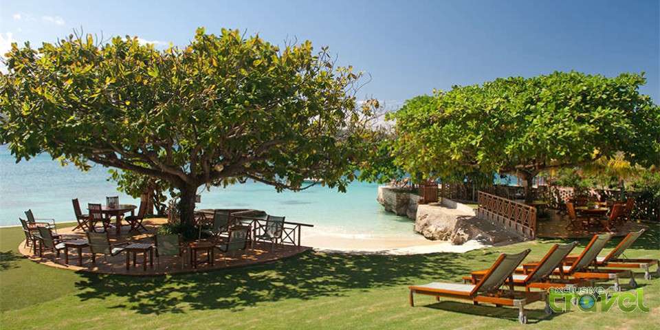 luxury holiday villa shaded beach seating near beach