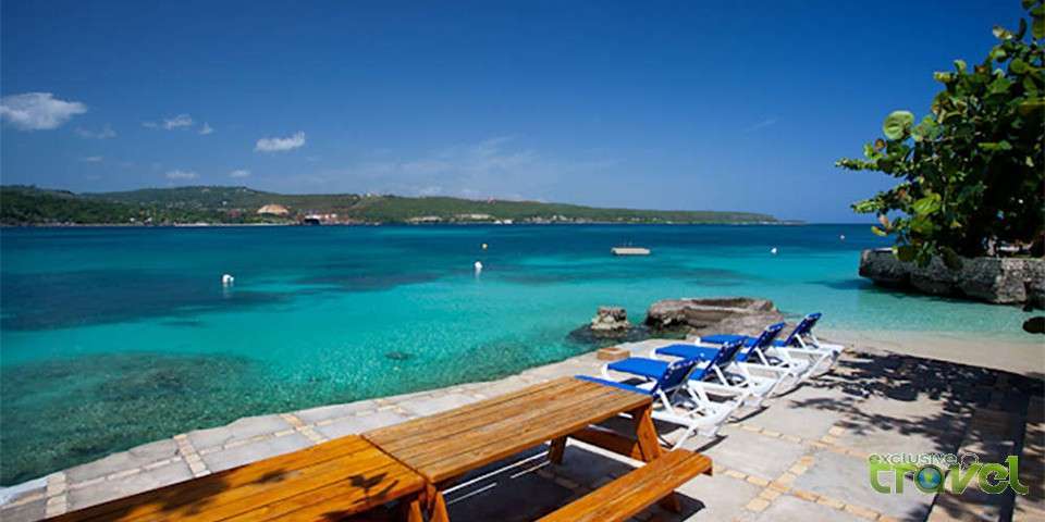 sunning by the beach in a top exclusive villa