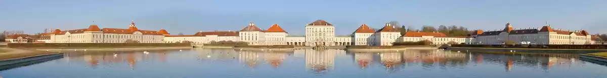 Panorama image of Munich palace buildings along the river