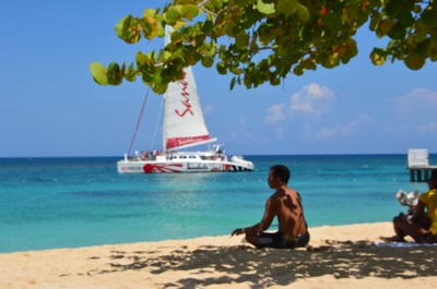 Sailing boat off shore of Doctors Cave