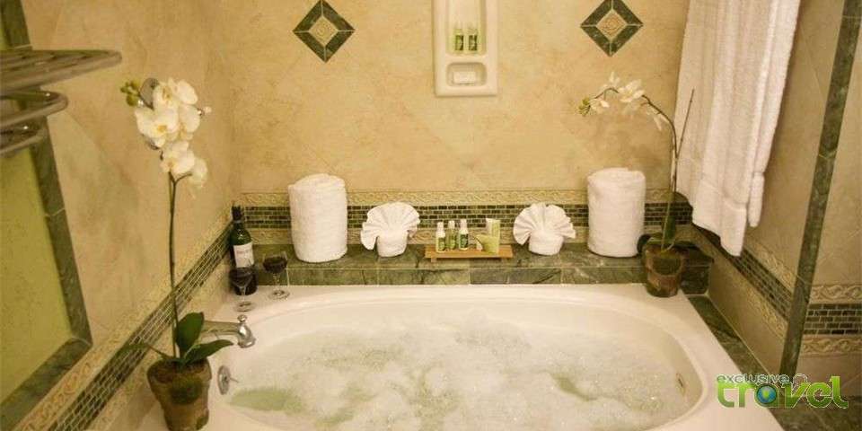 bedroom with ocean view bathroom