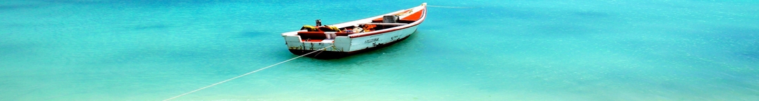 Panorama image of fishing boat on beach in Los Roques Venezuela